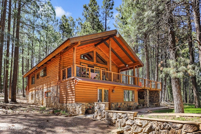 1868 Flicker Dr, Forest Lakes, AZ 85931 - view of front facade with stone siding, french doors, a wooden deck, and metal roof