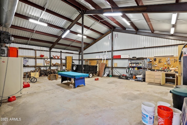 1868 Flicker Dr, Forest Lakes, AZ 85931 - garage featuring a workshop area and freestanding refrigerator
