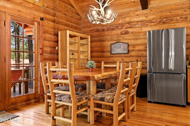 1868 Flicker Dr, Forest Lakes, AZ 85931 - dining space with rustic walls, a chandelier, light wood finished floors, lofted ceiling, and wooden ceiling
