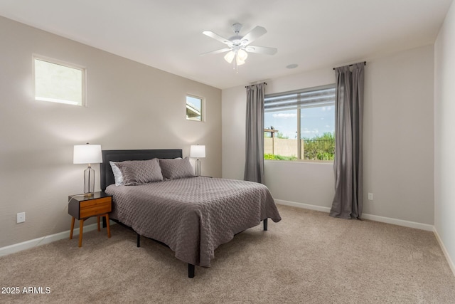 20783 W Pasadena Ave, Buckeye, AZ 85396 - bedroom with light carpet, baseboards, and ceiling fan