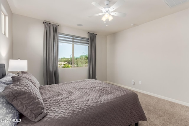 20783 W Pasadena Ave, Buckeye, AZ 85396 - bedroom with carpet flooring, baseboards, and a ceiling fan