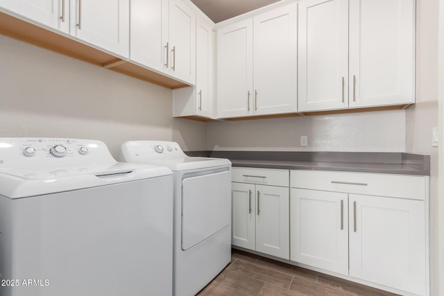 20783 W Pasadena Ave, Buckeye, AZ 85396 - washroom featuring washing machine and clothes dryer, cabinet space, and wood finish floors