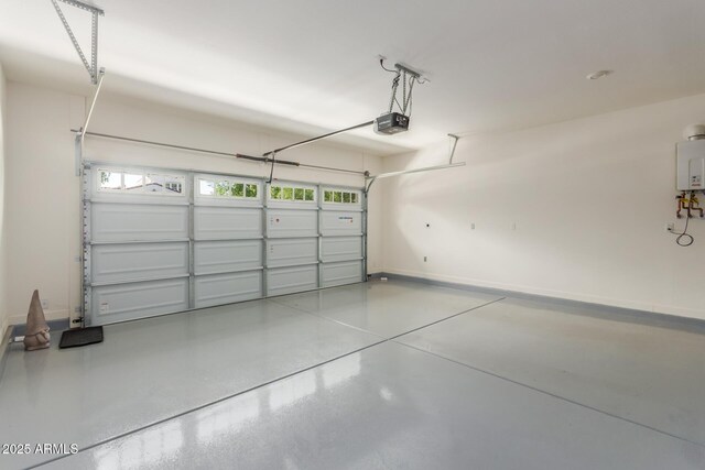 20783 W Pasadena Ave, Buckeye, AZ 85396 - garage with a garage door opener and baseboards