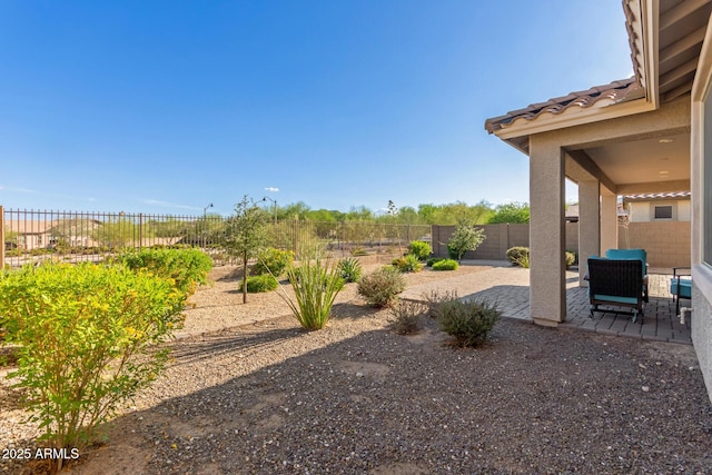 20783 W Pasadena Ave, Buckeye, AZ 85396 - fenced backyard featuring a patio area