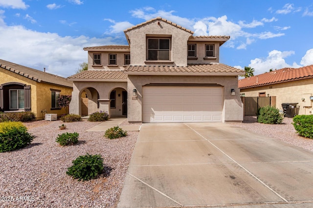 11106 E Serafina Ave, Mesa, AZ 85212 - mediterranean / spanish-style house with stucco siding, a tile roof, concrete driveway, and a garage