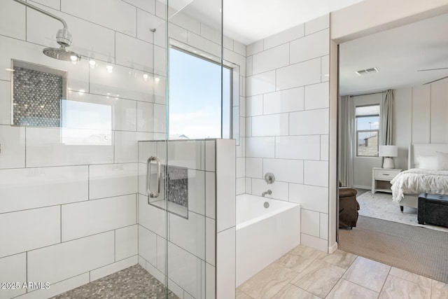 bathroom featuring ensuite bathroom, a shower stall, and a bath