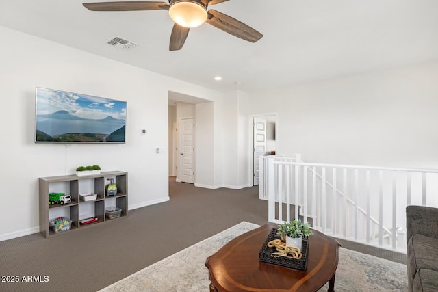 living area with carpet, a ceiling fan, baseboards, and recessed lighting