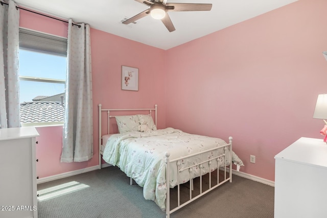 bedroom with carpet flooring, baseboards, and ceiling fan