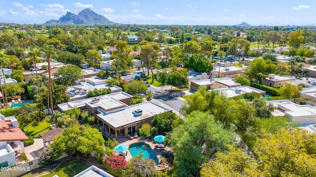 birds eye view of property with a mountain view