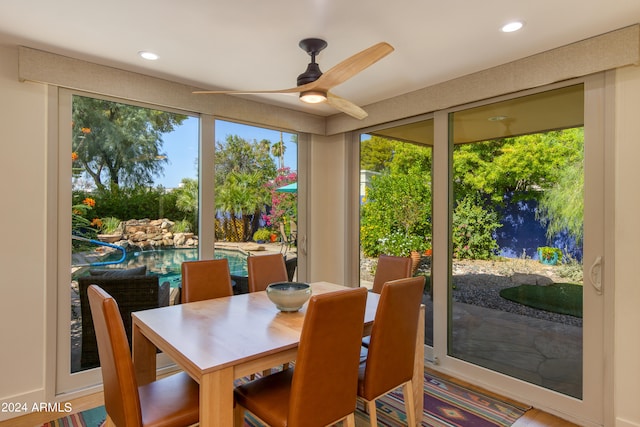 sunroom featuring ceiling fan and a healthy amount of sunlight