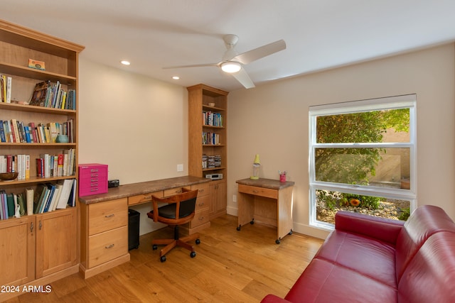 office space with light hardwood / wood-style floors and ceiling fan