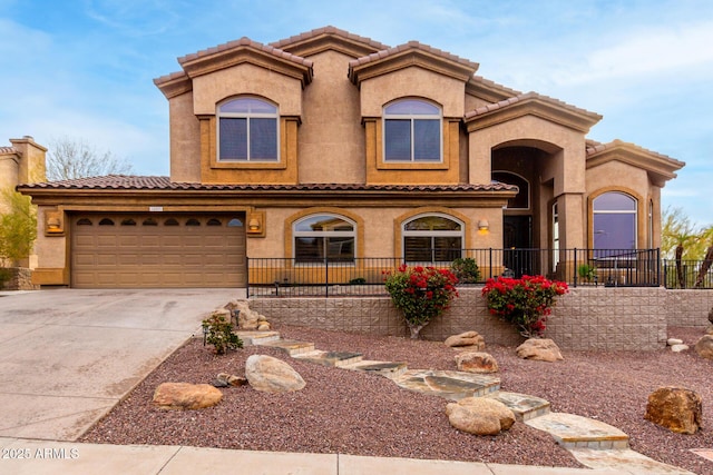 mediterranean / spanish-style home featuring a garage