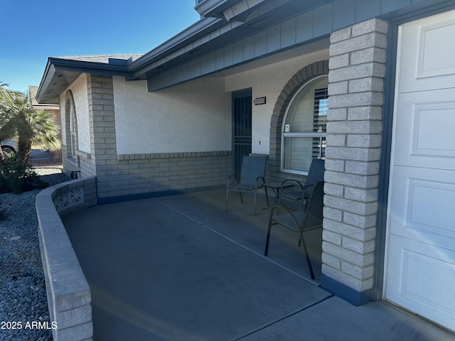 view of patio featuring a garage