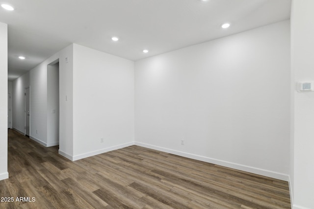 empty room with dark hardwood / wood-style floors