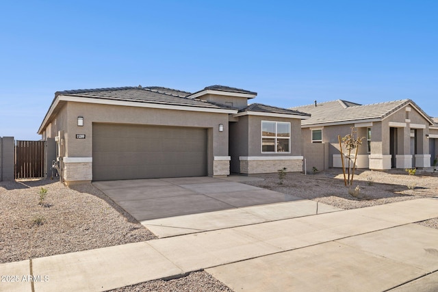 prairie-style home featuring a garage