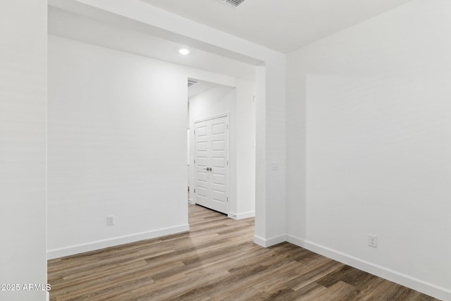 empty room featuring hardwood / wood-style flooring