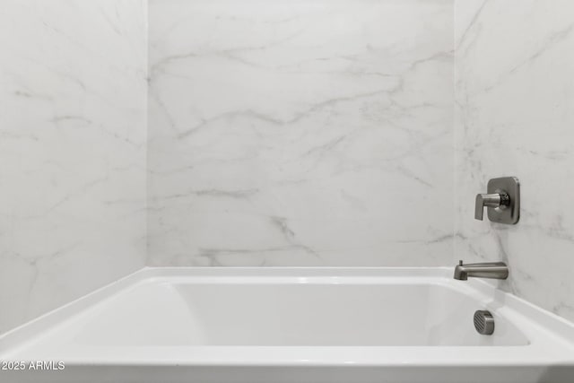 bathroom featuring a tub to relax in