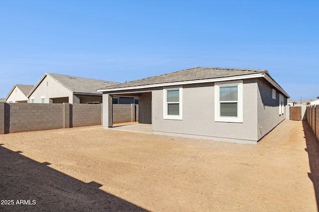 rear view of house featuring a patio