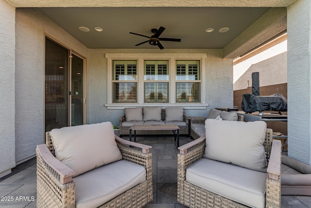 view of patio with an outdoor living space and ceiling fan