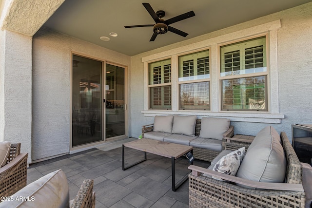 view of patio featuring an outdoor hangout area and ceiling fan