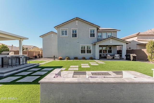 rear view of property with an outdoor living space, solar panels, a patio area, and a lawn