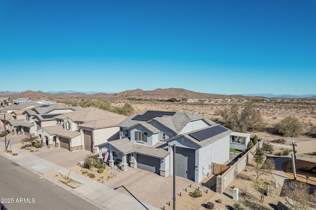 birds eye view of property with a mountain view