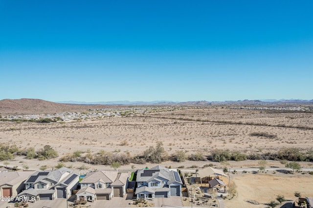 drone / aerial view featuring a mountain view