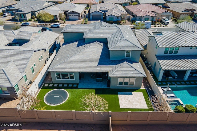 birds eye view of property with a residential view