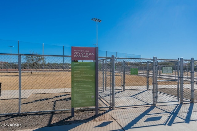 view of community featuring fence and a gate