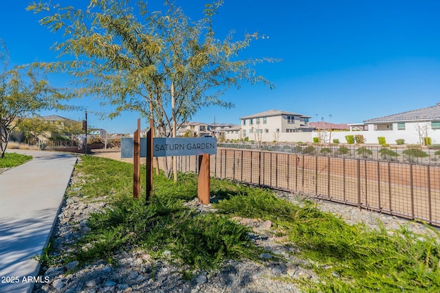 exterior space featuring fence and a residential view