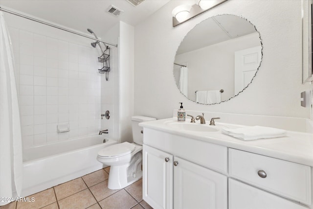 full bathroom featuring tile patterned flooring, vanity, toilet, and shower / bath combo with shower curtain