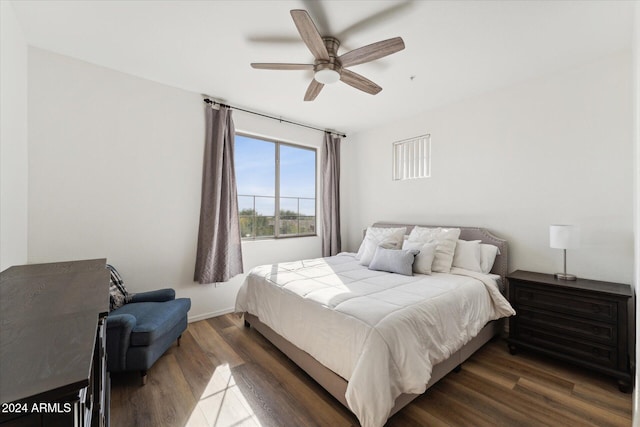 bedroom with ceiling fan and dark hardwood / wood-style flooring