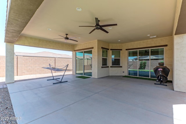 view of patio / terrace featuring ceiling fan