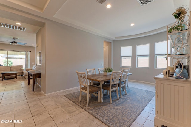 tiled dining area with ceiling fan