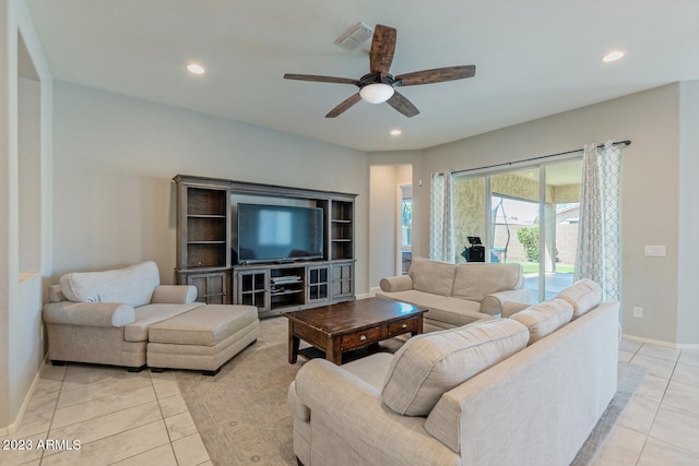 living room with ceiling fan and light tile patterned flooring