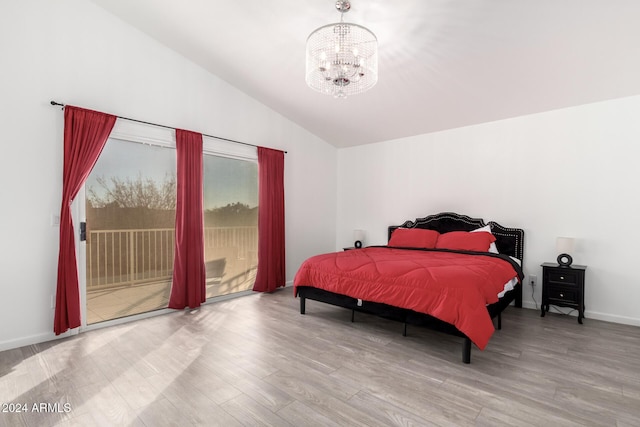 bedroom with lofted ceiling, a chandelier, access to outside, and light hardwood / wood-style floors