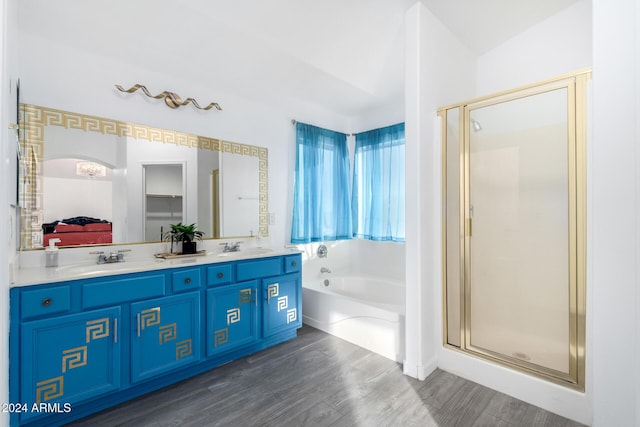 bathroom with vanity, separate shower and tub, and hardwood / wood-style floors