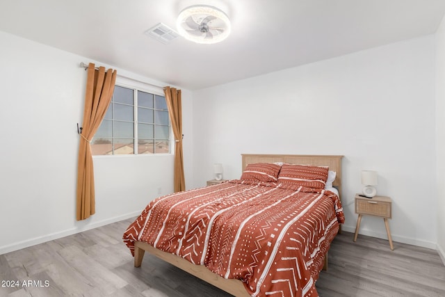 bedroom featuring wood-type flooring