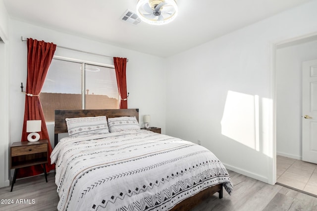 bedroom with light hardwood / wood-style floors