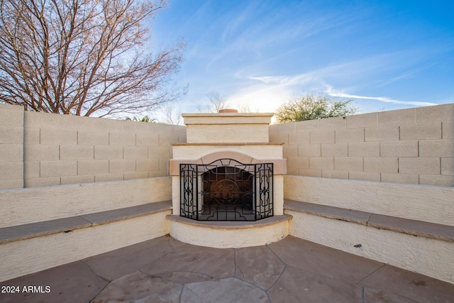 view of patio / terrace featuring an outdoor fireplace