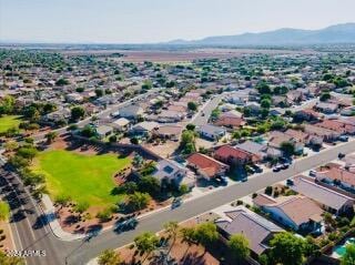 birds eye view of property with a mountain view