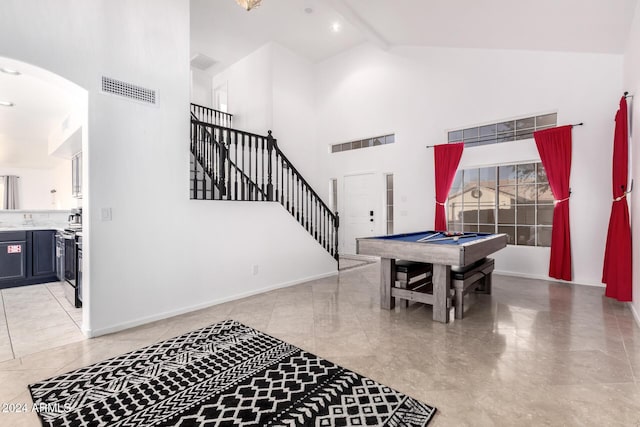 rec room featuring pool table, beam ceiling, and high vaulted ceiling