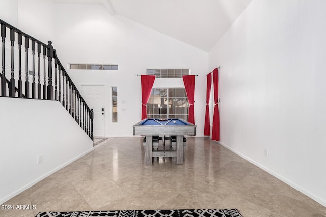 dining space featuring pool table and high vaulted ceiling