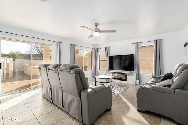 tiled living room with ceiling fan