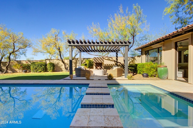 view of pool with outdoor lounge area, a patio area, and a pergola