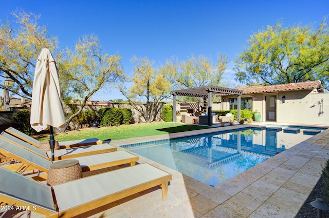 view of swimming pool with a patio area and a lawn