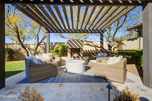 view of patio / terrace featuring an outdoor living space with a fireplace and a pergola