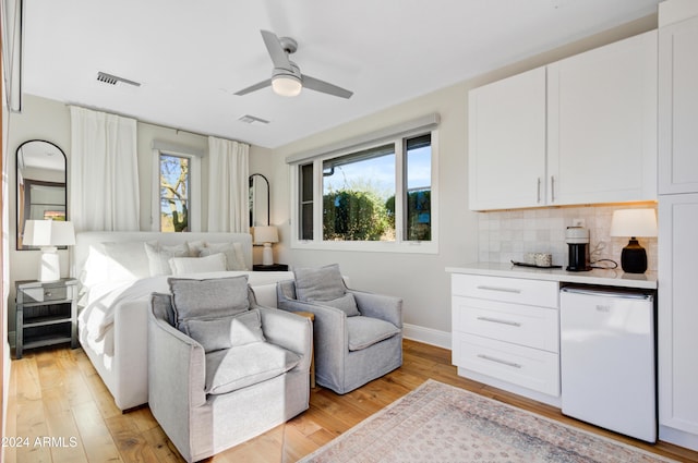 bedroom featuring light hardwood / wood-style flooring and ceiling fan