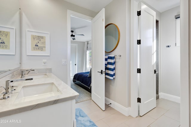 bathroom featuring tile patterned flooring, ceiling fan, and vanity