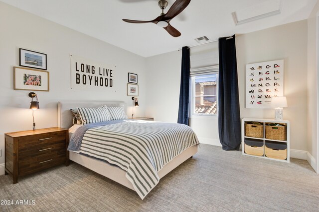 bedroom with light carpet and ceiling fan